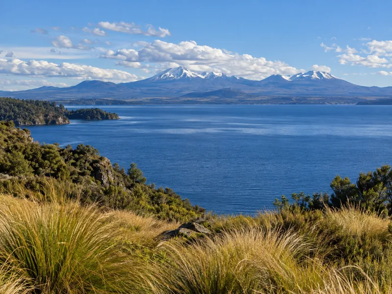 Lake Taupo with Tongariro's volcanic peaks in the distance
